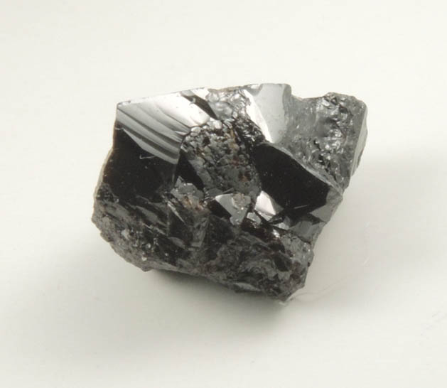 Cassiterite (twinned crystals) from Emmons Quarry, southeastern slope of Uncle Tom Mountain,  Greenwood, Oxford County, Maine