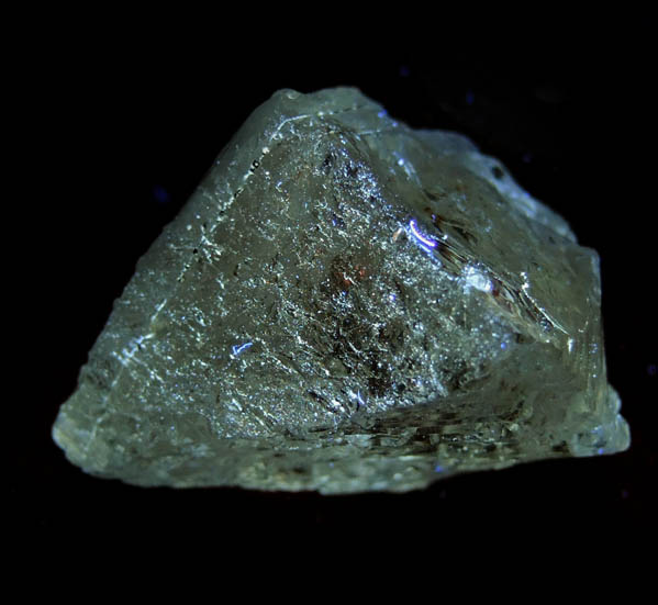 Photo below under longwave ultraviolet illumination of Topaz from Agnus Dei Claim, Tribute Pocket, near Crystal Park, El Paso County, Colorado Topaz from Agnus Dei Claim, Tribute Pocket, near Crystal Park, El Paso County, Colorado