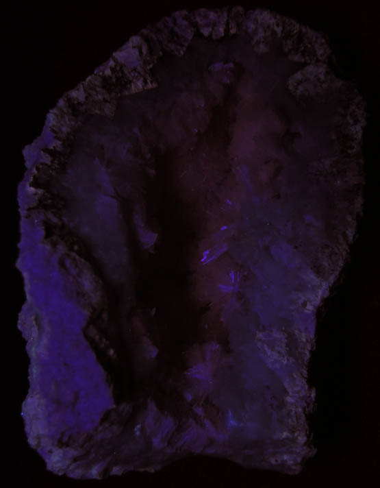 Photo below under shortwave ultraviolet illumination of Pectolite lining Datolite cavity from Millington Quarry, Bernards Township, Somerset County, New Jersey Pectolite lining Datolite cavity from Millington Quarry, Bernards Township, Somerset County, New Jersey